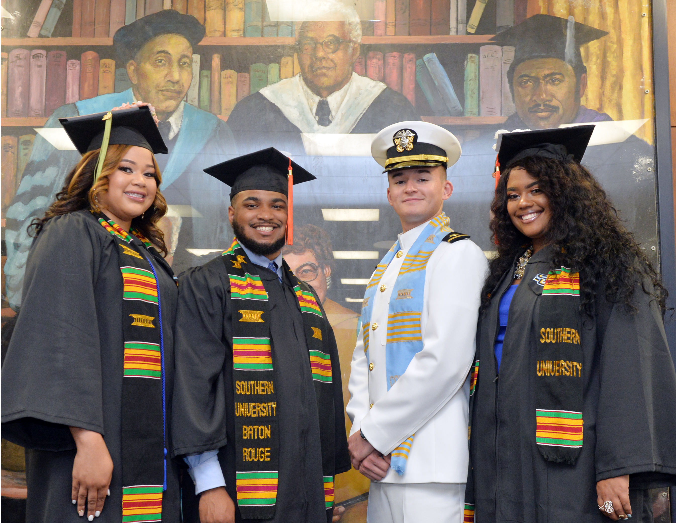 SU Students in regalia and NROTC graduate at commencement ceremony